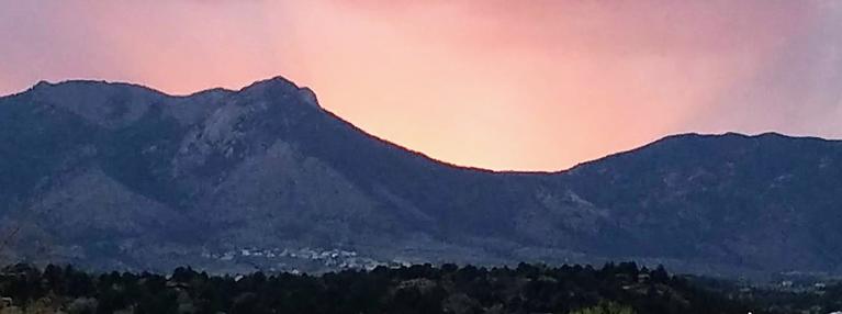 Sun Setting Behind the Front Range - by Melonie Courtright Sun Setting Behind the Front Range